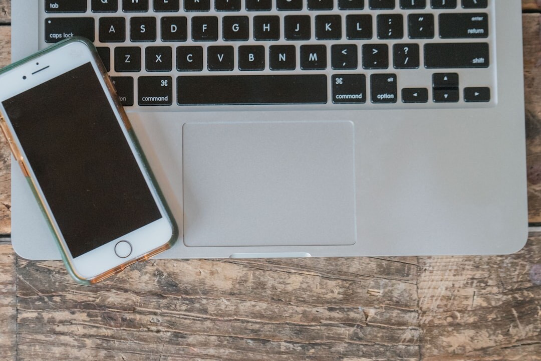 Open laptop and phone on a bright desk ready for messages