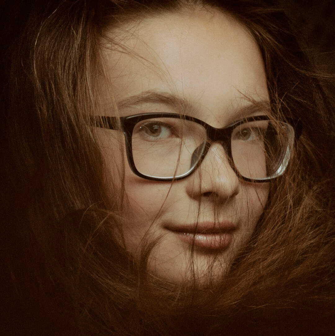 Portrait of a young woman writer with long hair