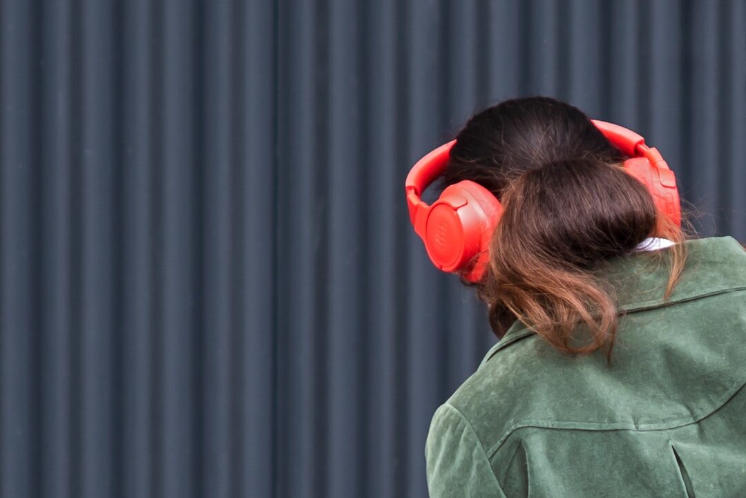 music fan listening on headphones
