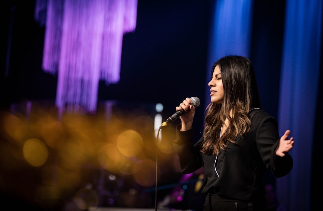 young female singer performing live