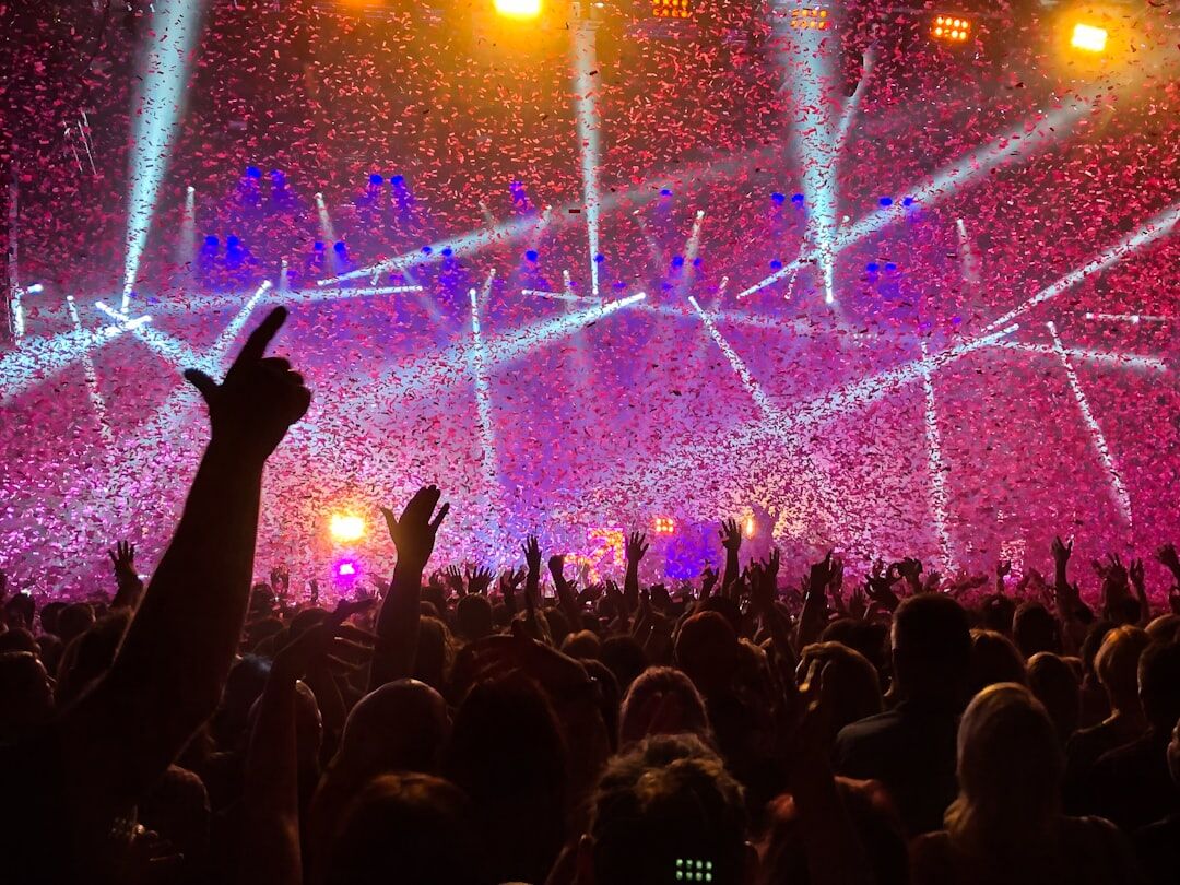 Concert stage with colorful lights and crowd